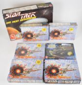 Seven AMT Ertl Sci-Fi plastic model kits comprising five Star Wars X-Wing Fighter 8932, a Trade