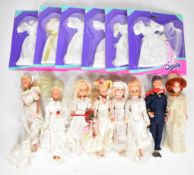 Eight Pedigree and Hasbro Sindy dolls dressed in bridal gowns together with six sealed Bride