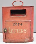Tram car mounted metal letter box with handle to top and brass turn latch, overall height