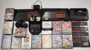 Three Sega retro video game consoles together with a collection of 22 Master System and Mega Drive