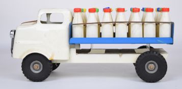 Tri-ang pressed steel milk truck or float with white cab and blue bed, complete with milk bottles.