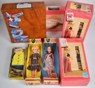 A collection of vintage Sindy items comprising two dolls, furniture, clothing and accessories,