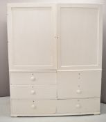 19th or early 20thC painted pine housekeeper's or linen cupboard with three drawers to base and