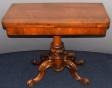 Victorian rosewood fold over games table with green baize interior, raised on a quatrefoil base, W91