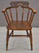 19thC elm seated armchair with handled backrest
