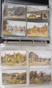 Album of vintage postcards, mainly pre 1930s topographical, many Oilette style cards including