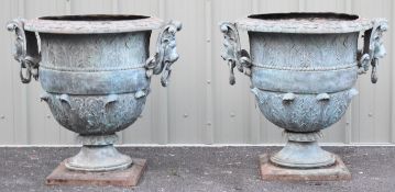 Leonardo Rossi pair of large bronze pedestal urns with scrolling lion mask ring handles and relief
