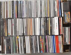 Approximately 125 mixed genre CDs including Bruce Springsteen, Punk, Blur, Soul, The Beatles,