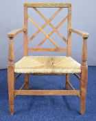 Oak Arts & Crafts rush seated child's or apprentice armchair, height 71.5cm