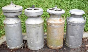 Four various vintage milk churns including Associated Dairies High Wycombe and two Blow cooler