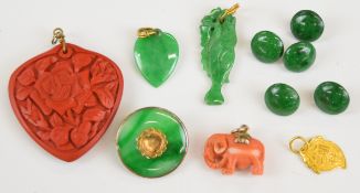 A yellow metal pendant (tests as 18k, 1g), two jadeite pendants one carved in the form of a fish and