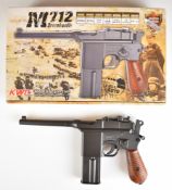 KWC Broomhandle Mauser M712 .177 blowback air pistol with faux wooden grips, serial number 45012156,