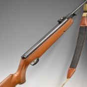 Webley Omega .177 air rifle with chequered semi-pistol grip, raised cheek piece, padded canvas and