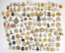 Large collection of approximately 100 British Army cap badges including Royal Sussex Regiment,