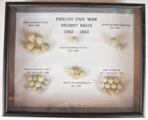 Mounted display of English Civil War musket balls comprising Siege of Basing House, Battle of