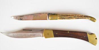 Two folding pocket knives one Laguiole with horn or similar handle and 10cm blade the other Puma