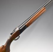 Browning Citori 12 bore over and under ejector shotgun with named underside, chequered semi-pistol