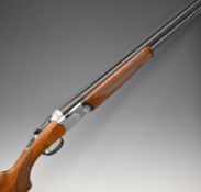 Beretta Model S687 12 bore over and under ejector shotgun with engraved scenes of birds to the locks