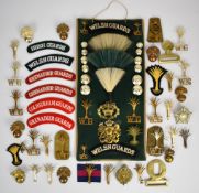 Collection of approximately 30 Grenadier and Welsh Guards badges including cap badges, shoulder