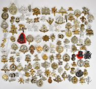 Large collection of approximately 100 British Army cap badges including Middlesex Regiment,
