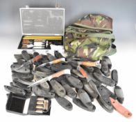 A collection of gun accessories including Midwater PCP cylinder carry bag, recoil pads, shotgun