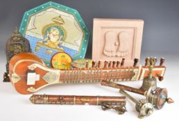 Collection of Indian / Tibetan collectibles including a sandstone sculpture of feet, graduated