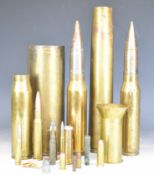 Six brass shell cases including 1917, two with projectiles, together with some insert small arms