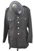 Police Officer's tunic with associated insignia and buttons together with a helmet with
