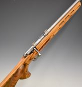 Savage Model 93R17 .17 HMR bolt-action rifle with thumb-hole grip to the laminated show wood