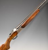 Miroku 12 bore over and under ejector shotgun with engraved locks, chequered semi-pistol grip and