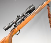 Ruger M77 Mark II .243 bolt-action rifle with chequered semi-pistol grip and forend, leather
