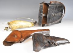 Two military leather revolver or pistol holsters including one to suit a Luger P08 or similar pistol