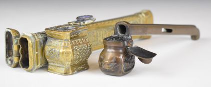 Two brass or bronze scribe's boxes with engraved decoration, longest 19cm