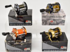 Four Abu Ambassadeur multiplier fishing reels comprising 6500CT Premium Mag-Elite, 6600DS, 6600C4