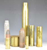 Two shell cases with projectiles, one dated 1942 the other 1904, together with three additional