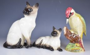 Beswick woodpecker and Siamese cat figures, tallest 27cm