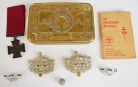 WW1 Princess Mary Christmas tin, together with four Gloucestershire Regiment badges, copy VC