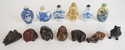 Collection of Chinese and Japanese snuff bottles, netsukes and amber or similar Buddha figure,