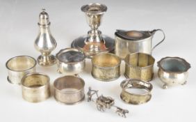 Hallmarked silver items comprising six various napkin rings, pair of salts raised on ball feet,