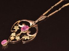 Edwardian 9ct gold pendant set with pink paste (5 x 2.5cm) on 9ct gold chain made up of twisted