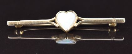 A 9ct gold brooch set with a heart cut opal, 2.6g, 5cm