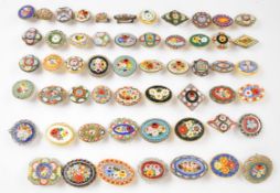 Fifty-four micro mosaic brooches including 19thC examples, mainly floral scenes