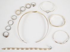 Eight silver rings including six set with diamonds, three silver bangles including two set with
