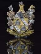 A c1930 18ct gold tri-coloured brooch in the form of a crest engraved 'fortitude et prudentia' and