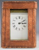 Late 19th or early 20th century brass cased carriage clock with bevelled glass and white enamel dial