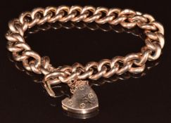 A 9ct rose gold curb link bracelet with heart padlock clasp, 21.6g, 18cm
