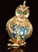 A 9ct gold charm in the form of an owl set with a crystal bead, 14.2g, 3.1cm
