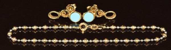 A 18ct gold bi-coloured bracelet and a pair of 18ct gold earrings (7.6g)