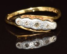 An 18ct gold ring set with five diamonds in platinum setting, 2.8g, size O