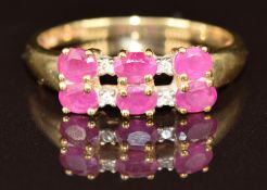 A 9ct gold ring set with oval cut rubies and diamonds, 2.5g, size T